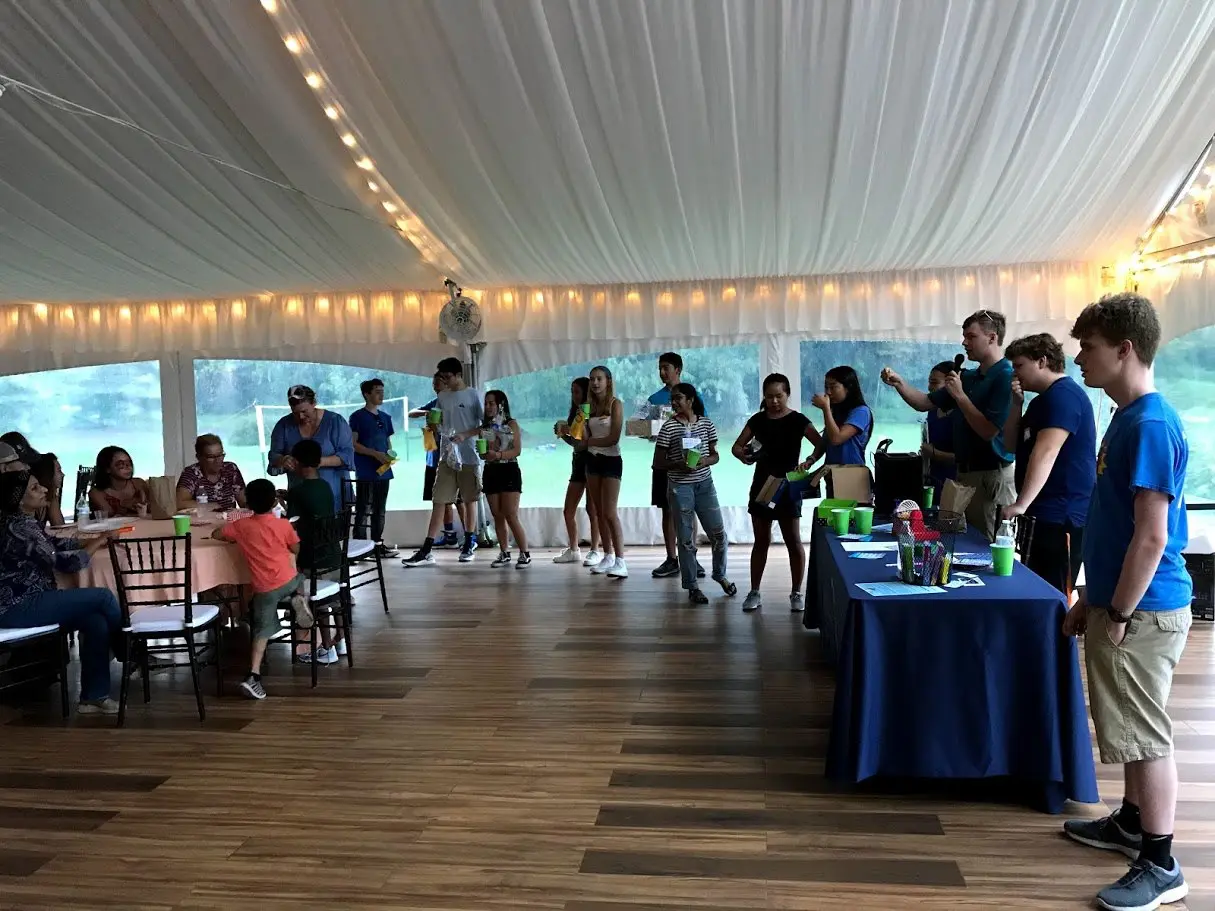 People inside tent for Global Leadership fundraiser