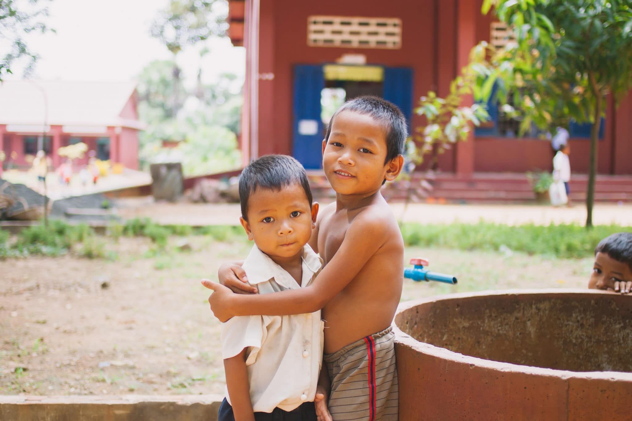 Boys in Cambodia hugging