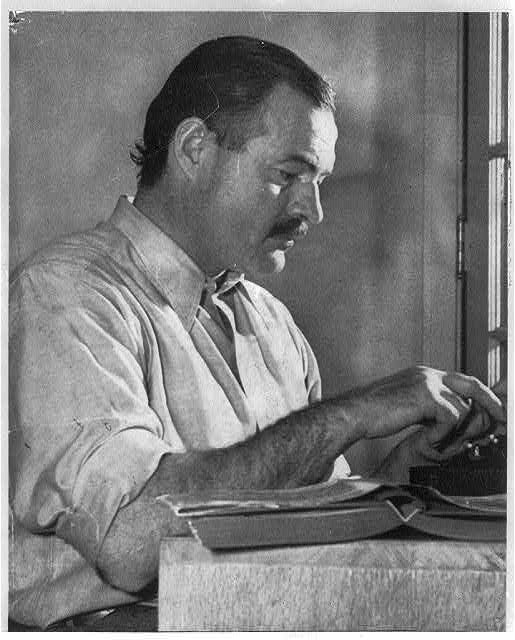 Ernest Hemingway seated at typewriter, 1939. Arnold, Lloyd R, photographer. Library of Congress
