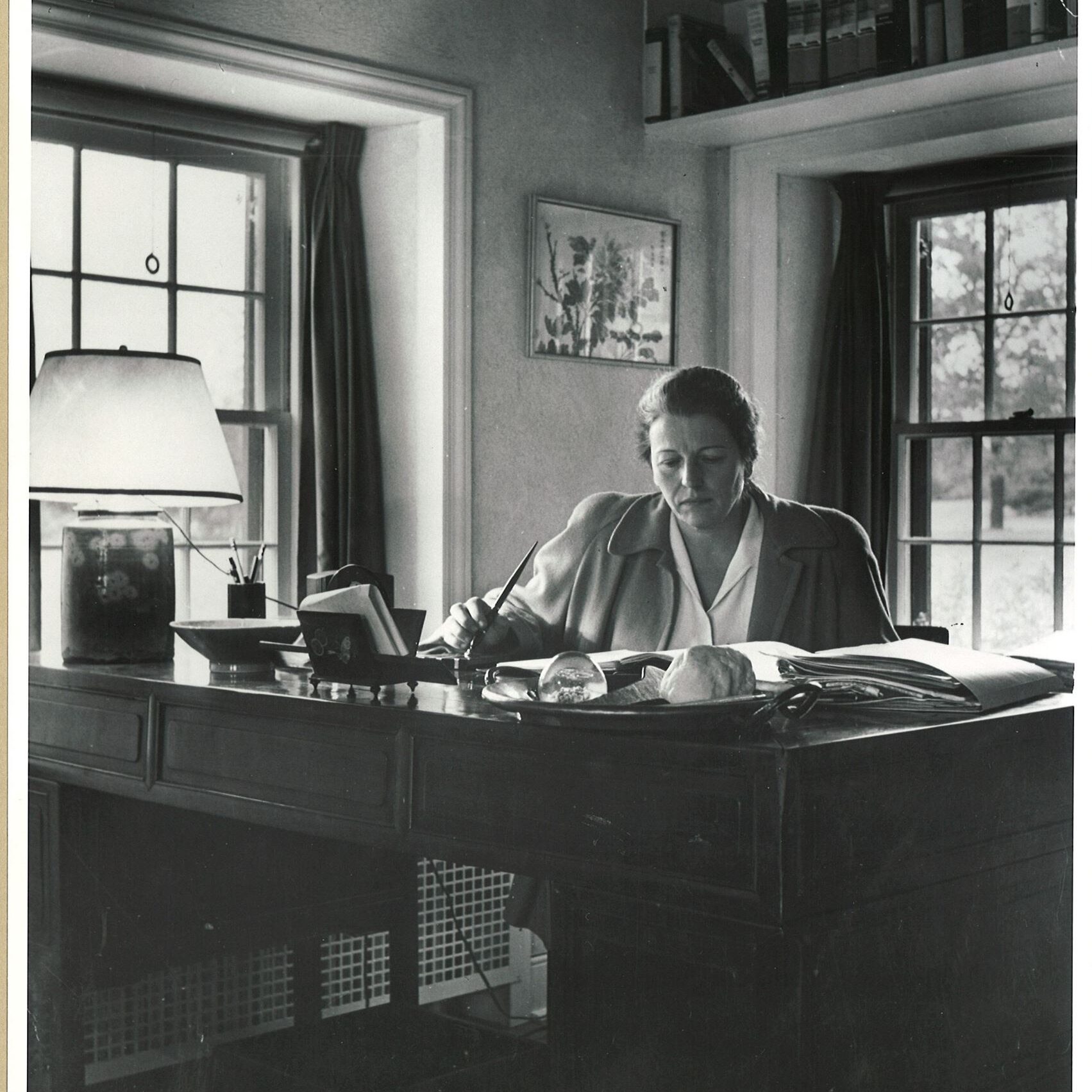 Pearl Buck sitting at her desk