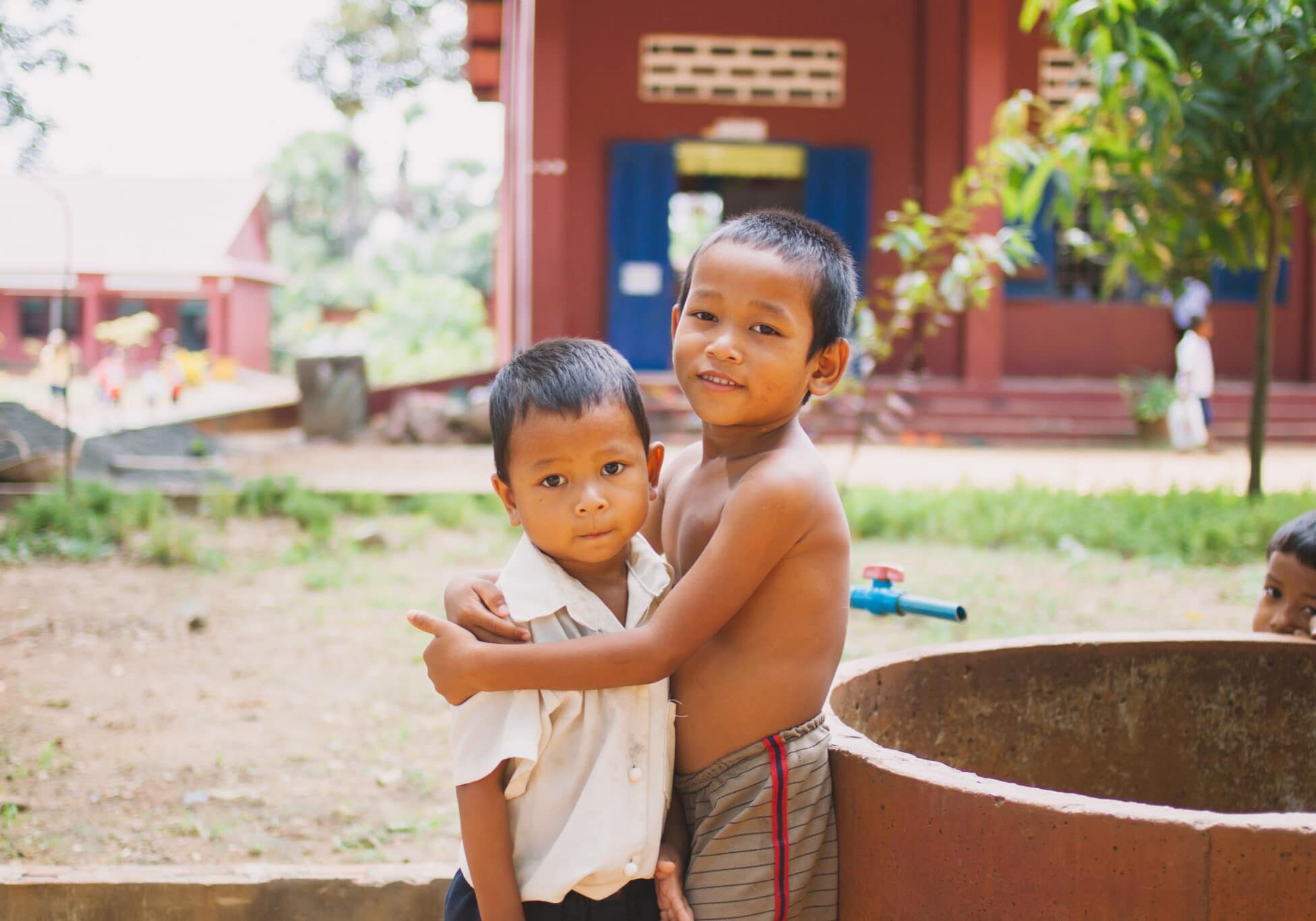 Boys in Cambodia hugging